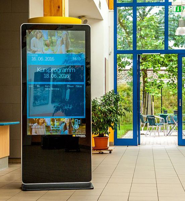 Photo of a small digital totem display in a retail environment